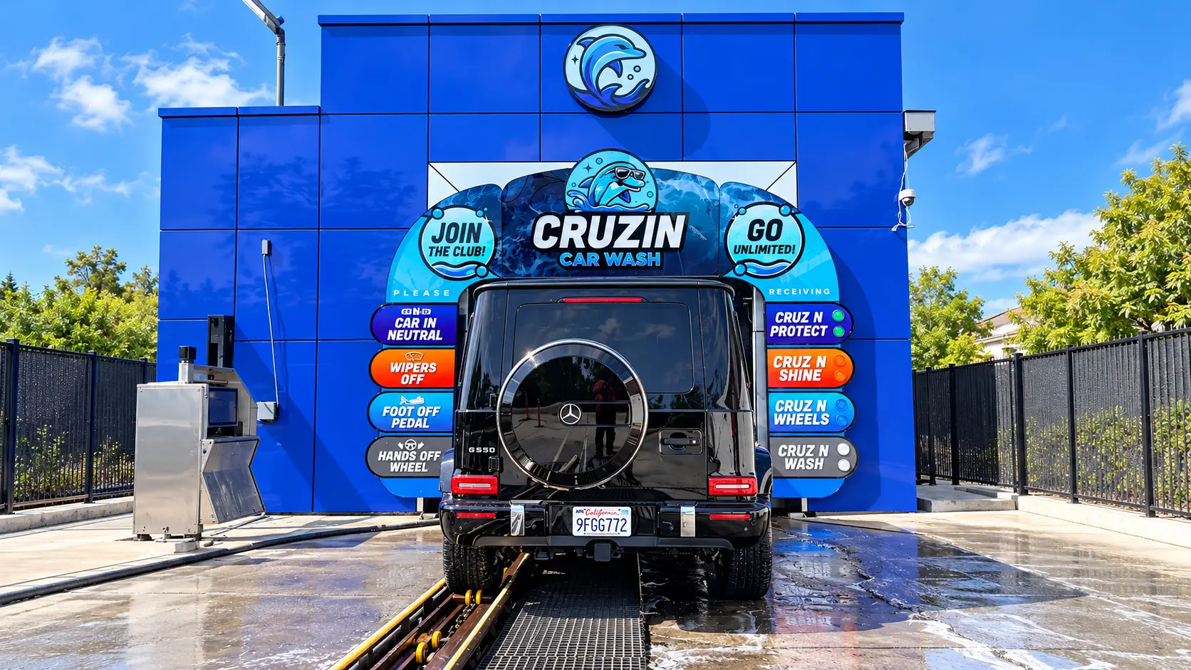 Black Mercedes G-Wagon entering the blue Cruzin Car Wash tunnel